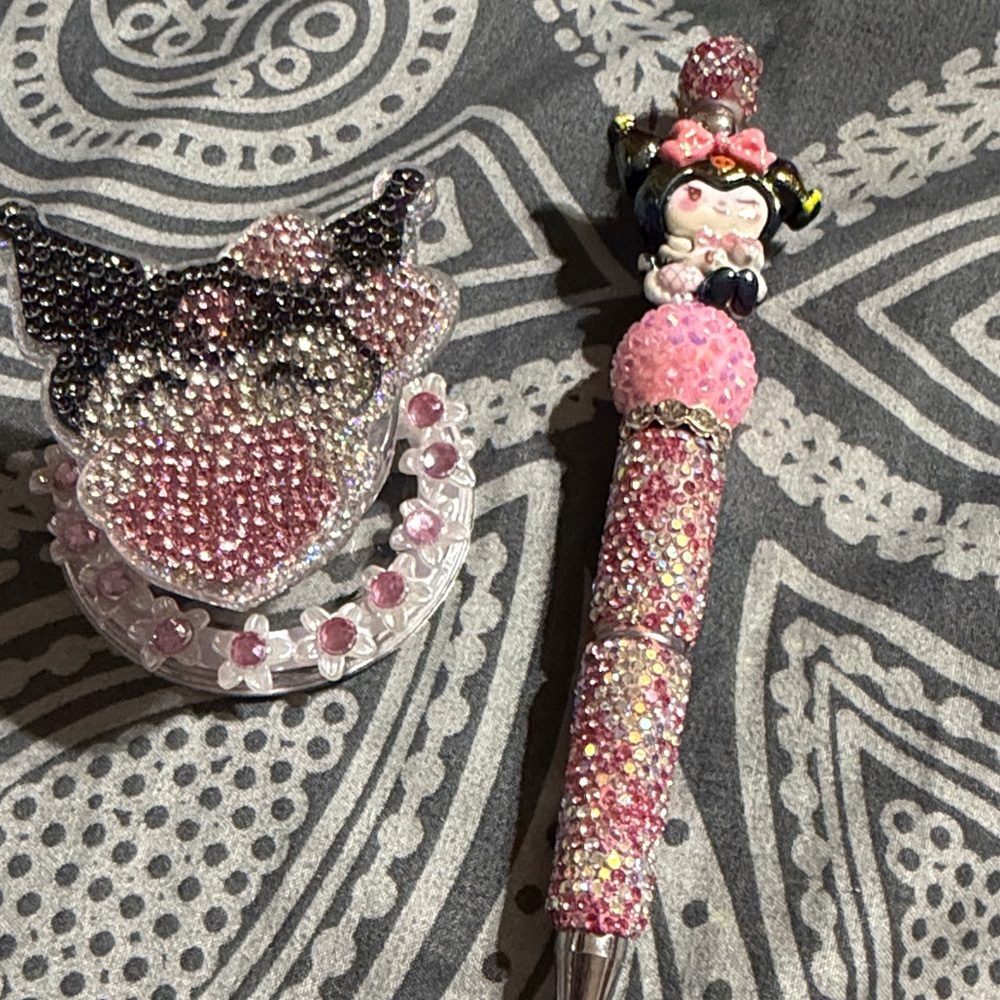 Sparkling Pink and Black Kuromi magnetic pop socket and pen set.